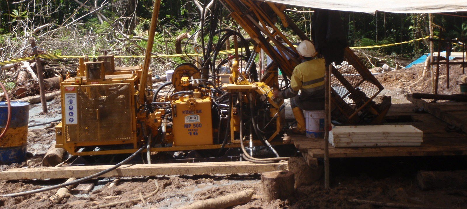 Deep Drill Indonesia diamond drill rig operating on a remote jungle drill pad